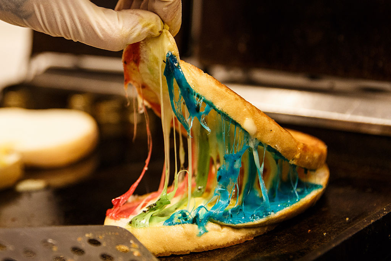 Rainbow-colored toast, using a lavender, basil and tomato cheese, from a restaurant in Hong Kong. (Photo: Anthony Wallace/AFP/Getty Images)